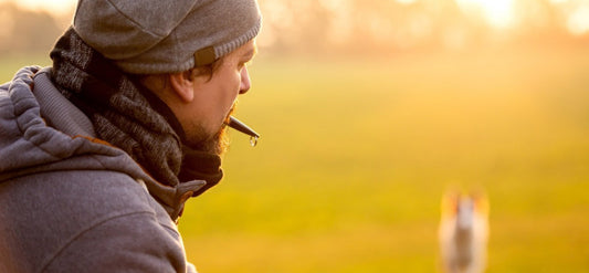 man with dog whistle in his mouth